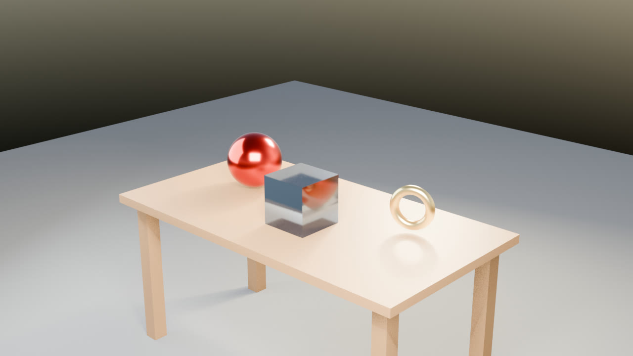 A wooden table with a red metal sphere, a blue cube, and a gold ring.